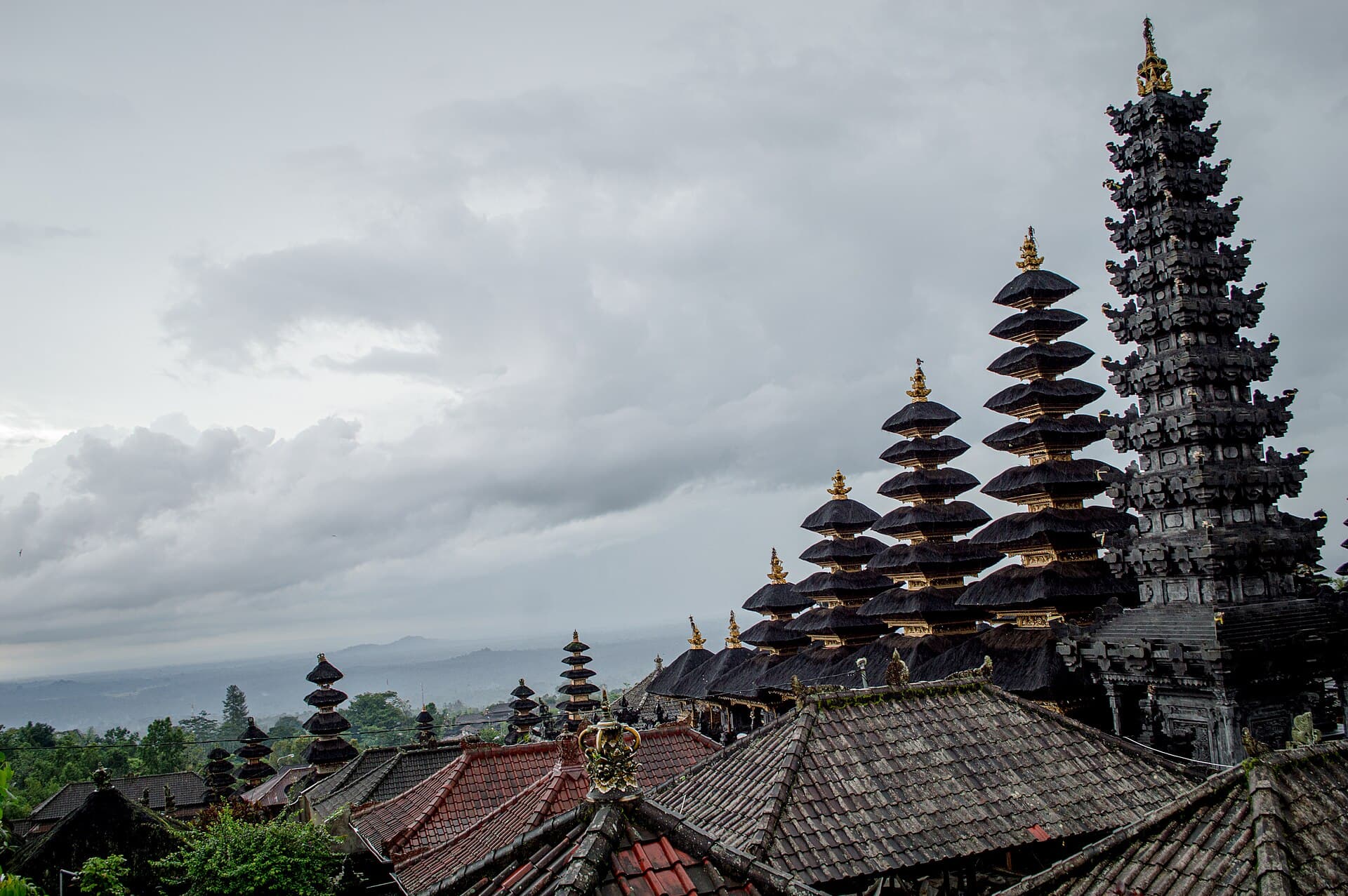 Golden-roofed towers with the land falling away far below