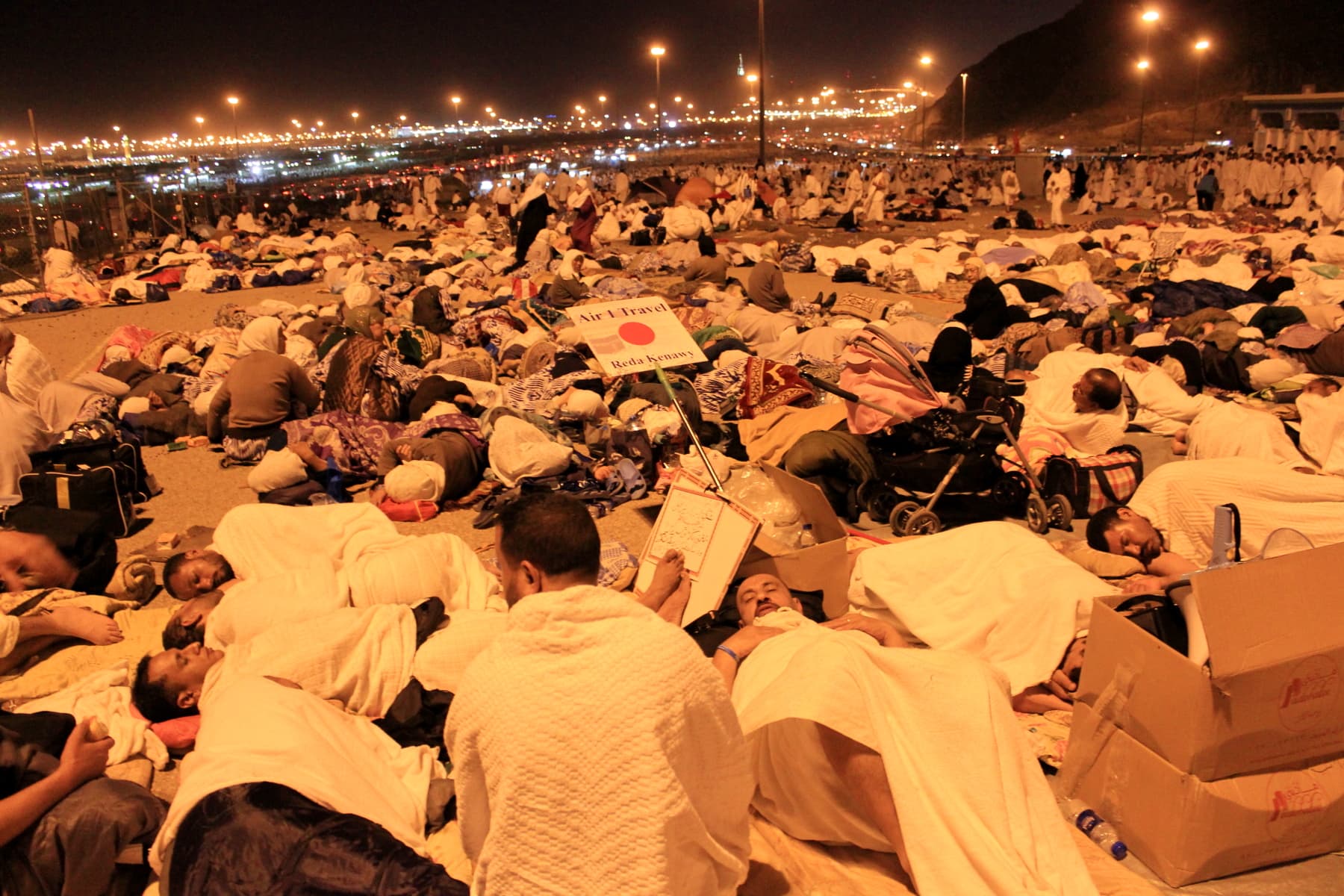 Pilgrims lying on the ground to pass the night under the open sky