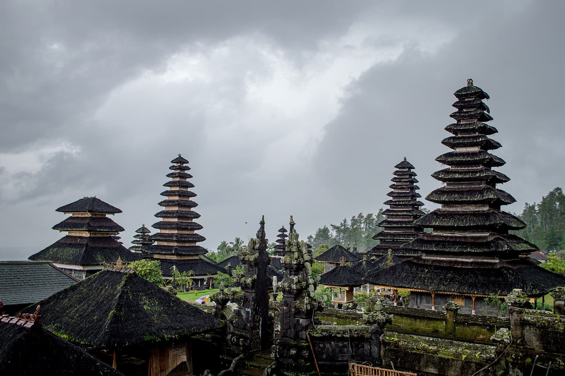 The black meru towers of Besakih rising tier upon tier beneath storm clouds