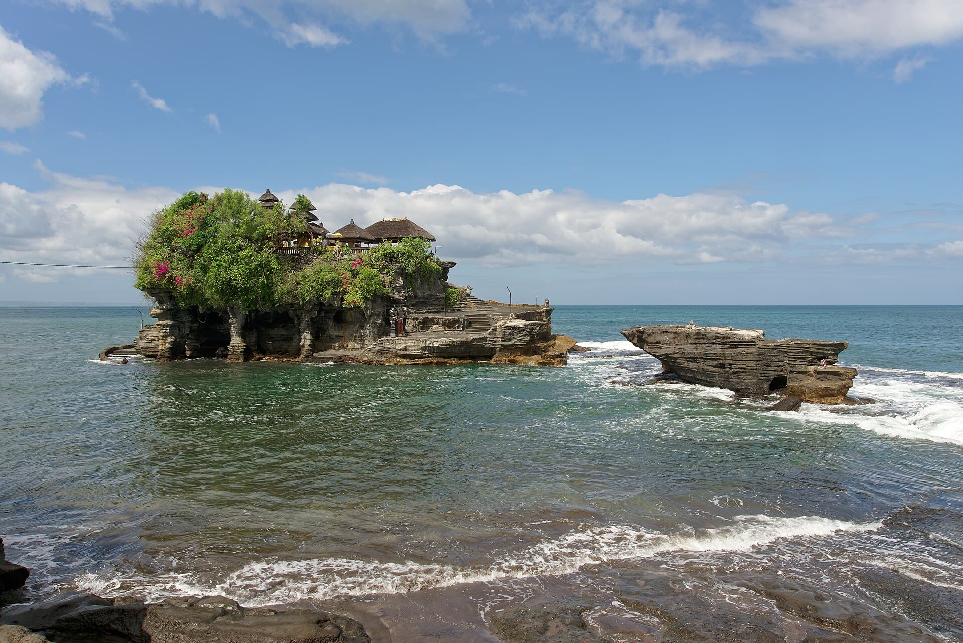 Pura Tanah Lot standing alone on its sea rock, ringed by the rising tide