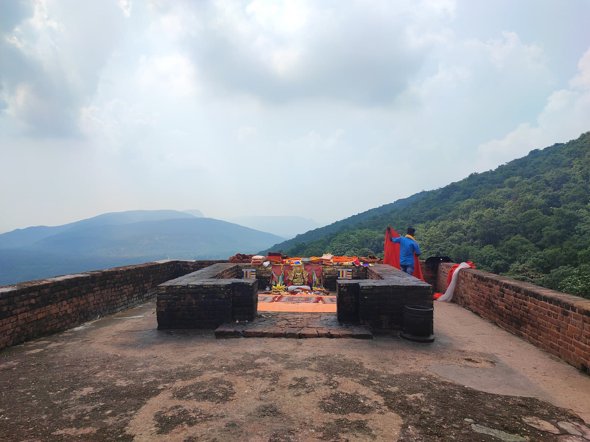 The brick shrine at the summit's teaching site, valleys unfolding fold upon fold below