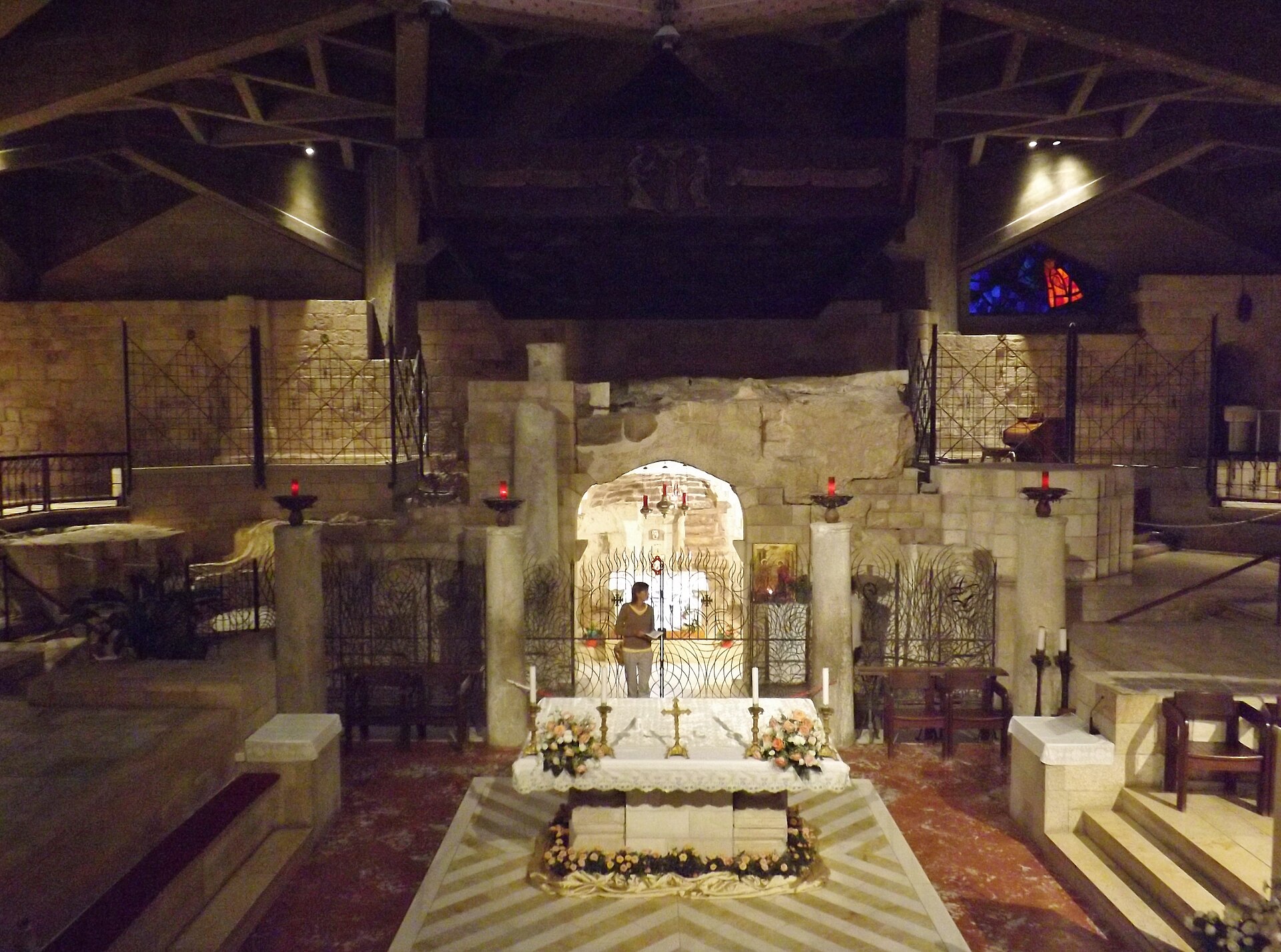 The grotto of Mary's home and votive candles in the basilica's lower church
