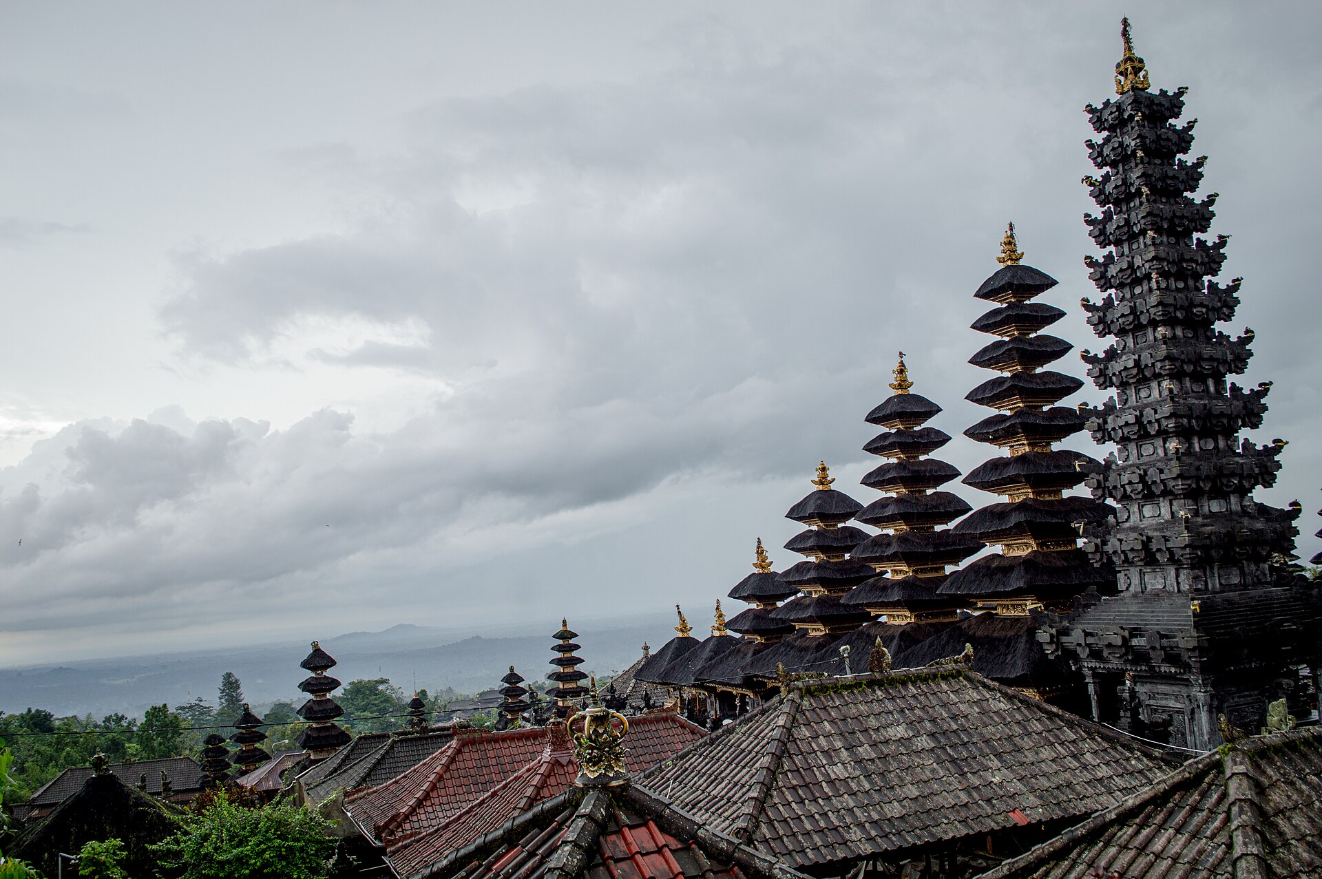 Golden-roofed towers with the land falling away far below