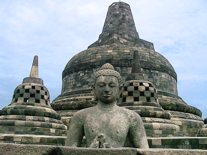 A Buddha seated within a bell-shaped stupa