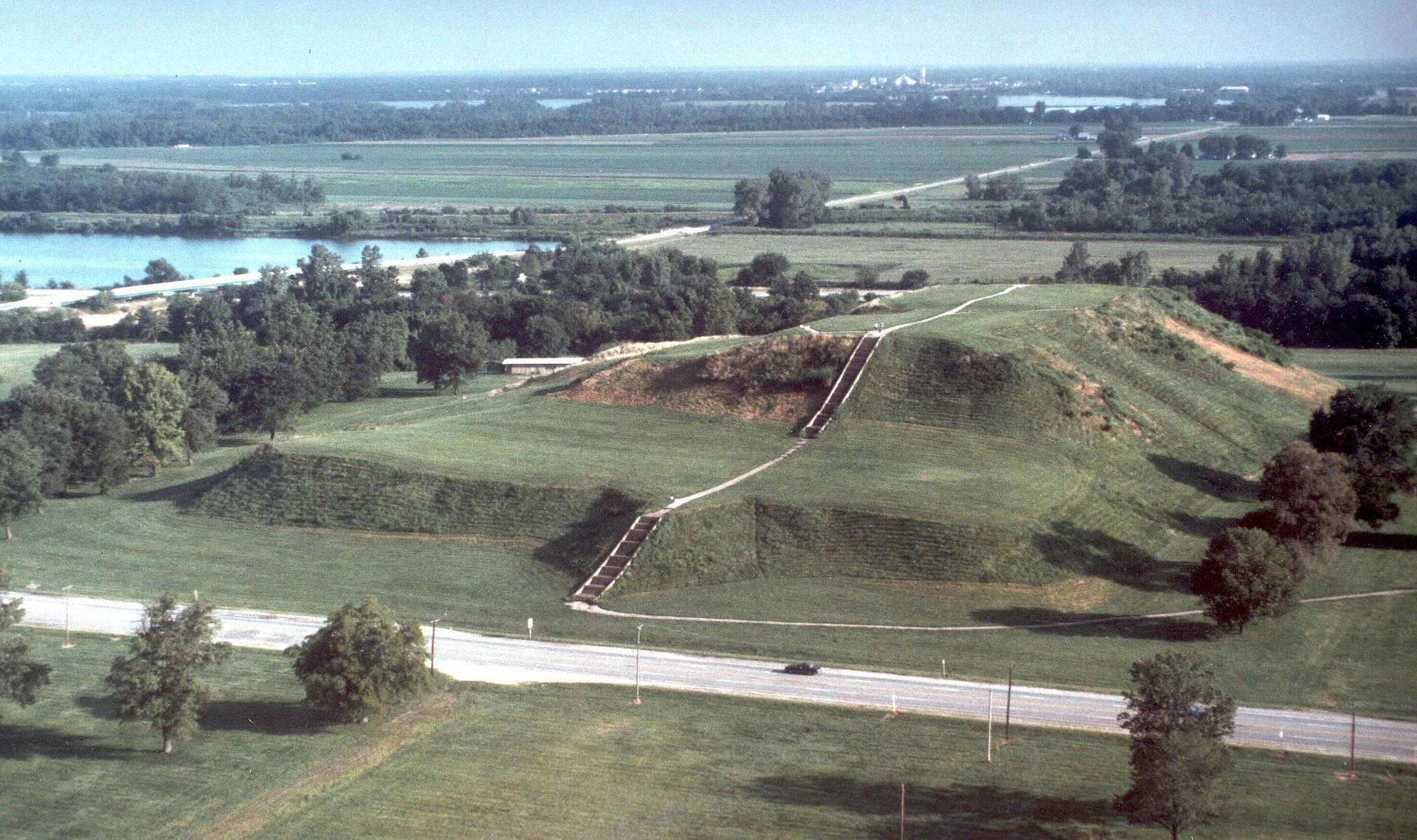 An aerial view of Monks Mound, the surrounding mounds, and the Mississippi beyond