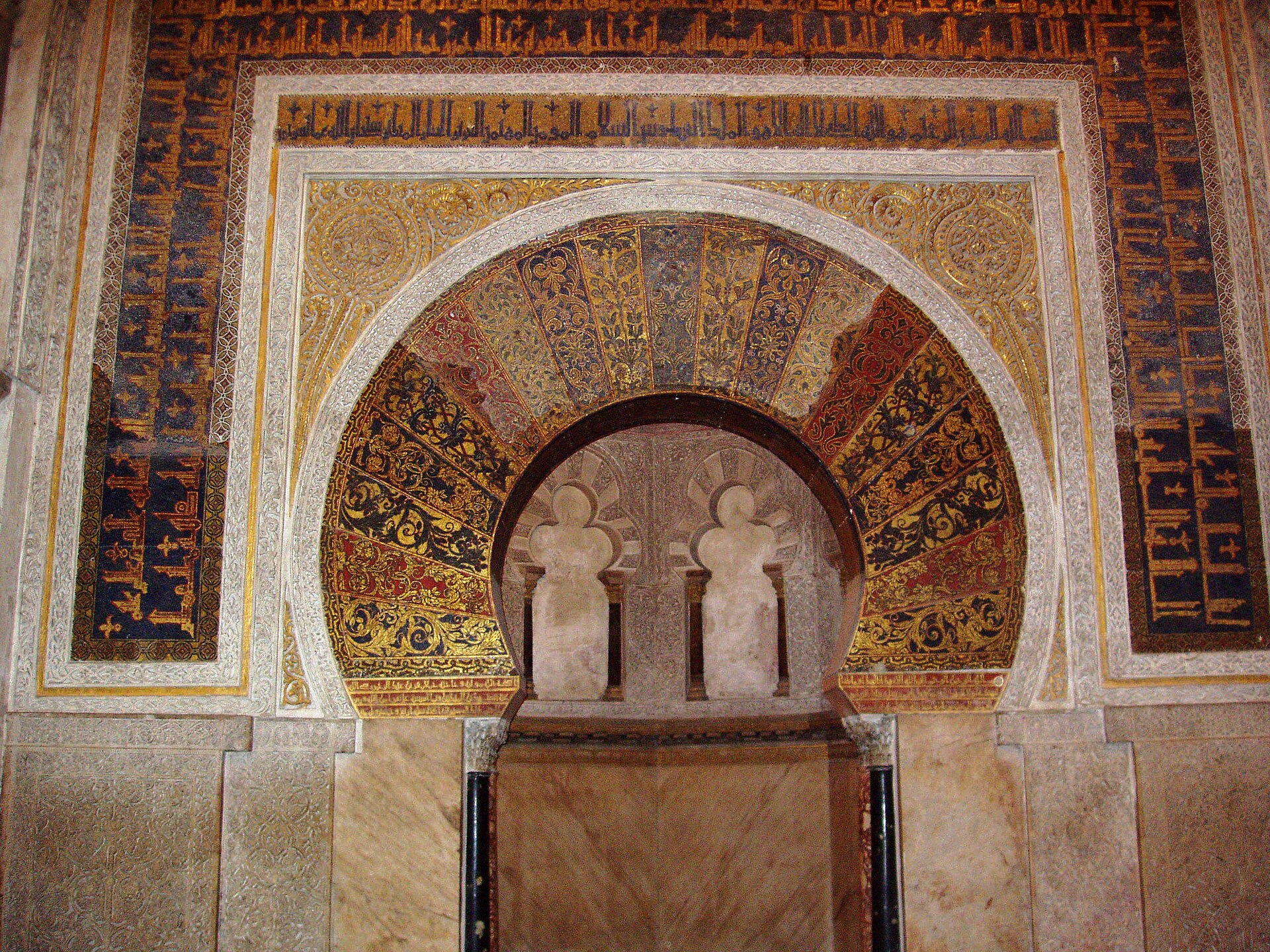 Córdoba's mihrab horseshoe arch framed in golden mosaic