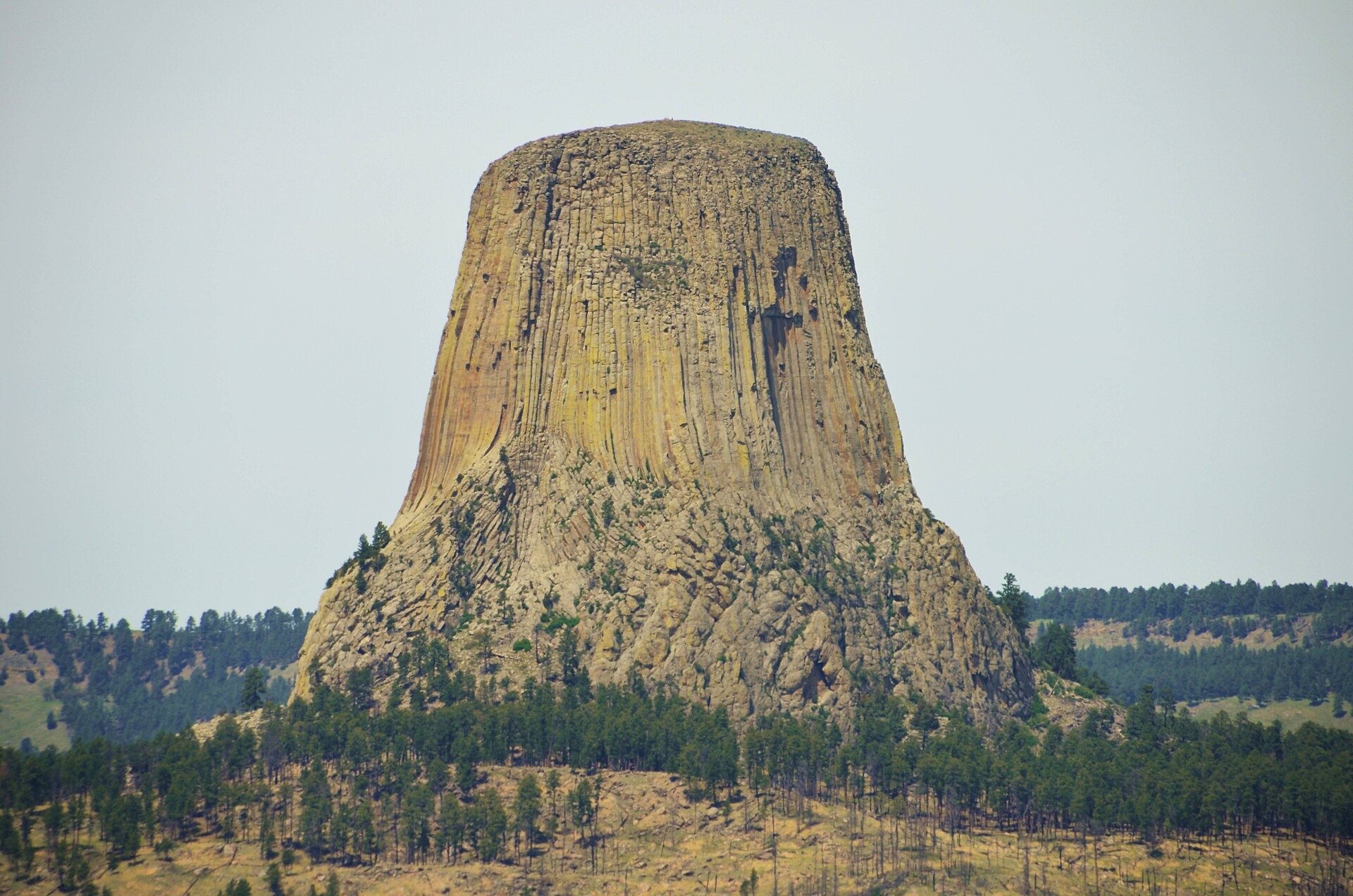 The lone grey stone tower rising above the plains, seen from a distance