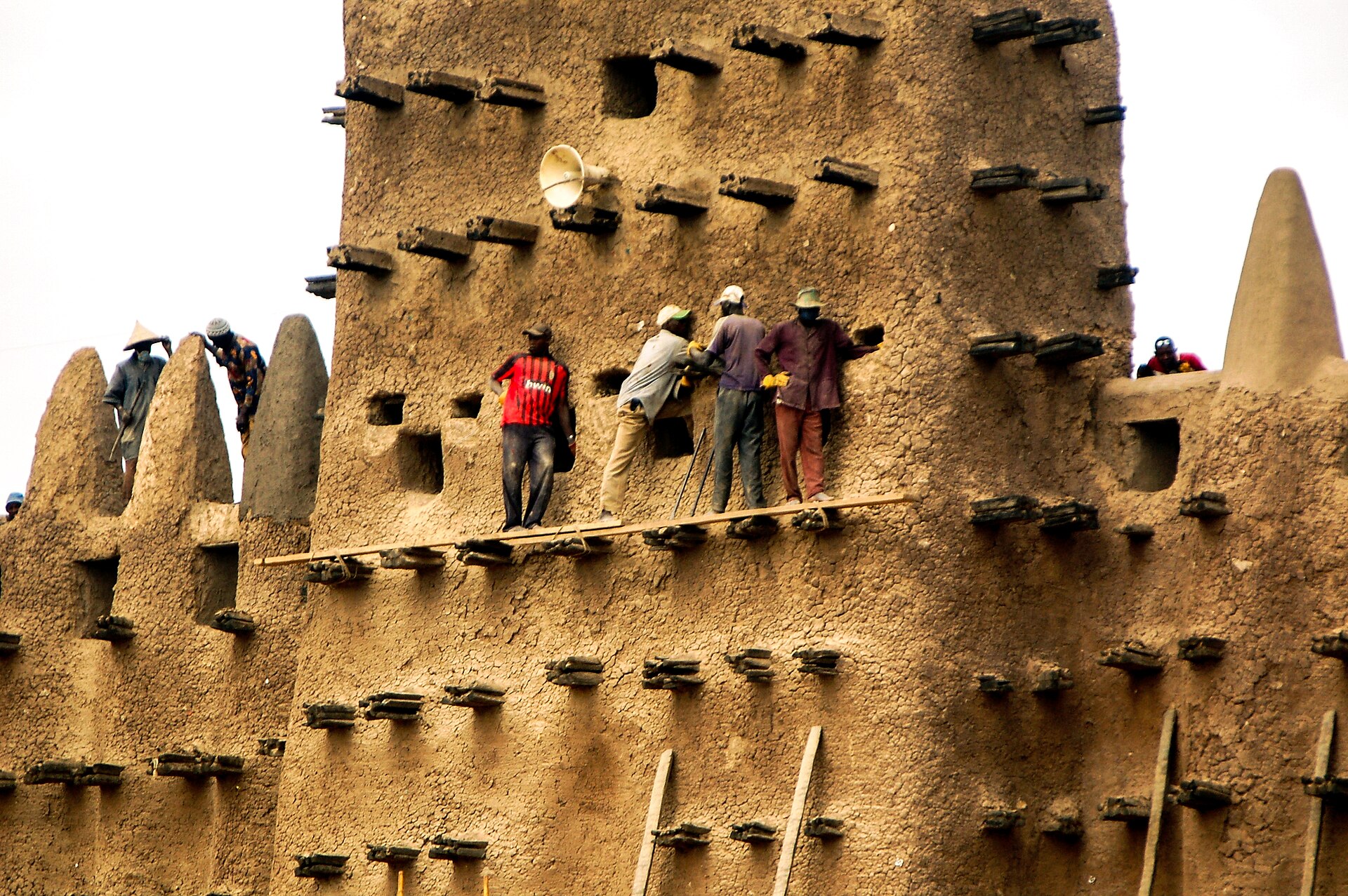 The whole town re-plastering the walls with mud during the crépissage