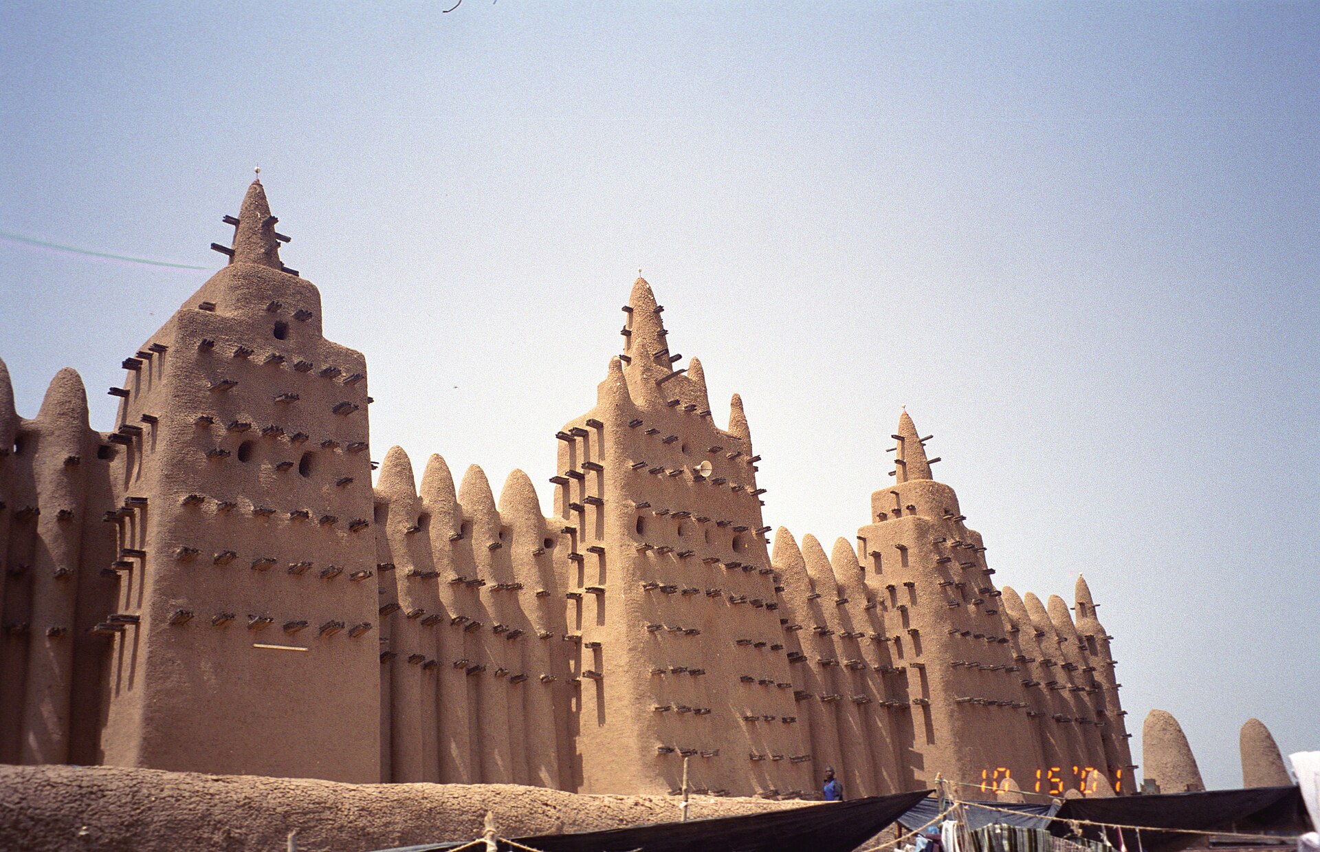 A close view of the Great Mosque's mud towers studded with palm-wood beams