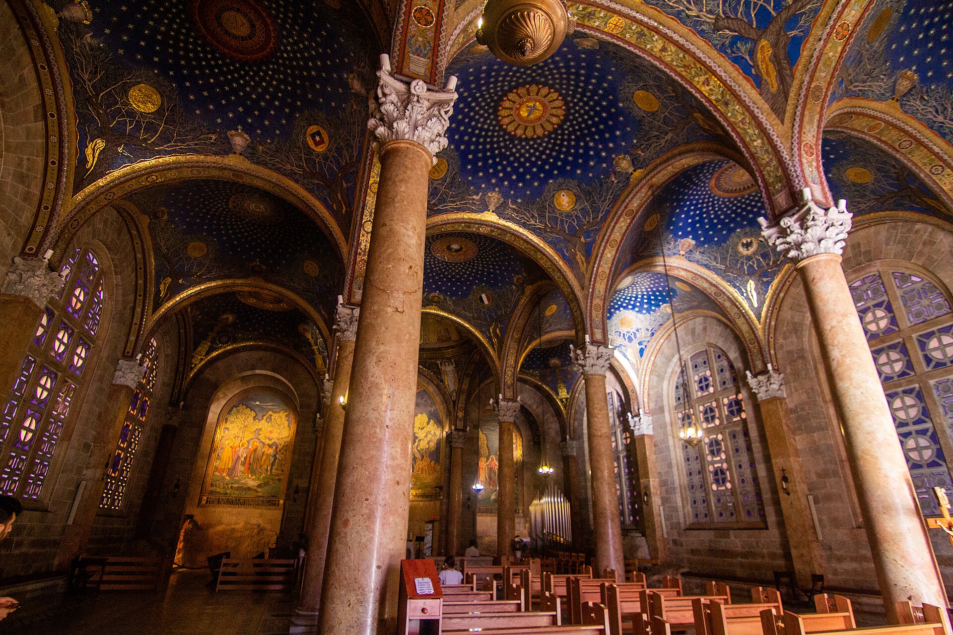 Interior of the Church of All Nations, its deep-blue ceiling scattered with stars