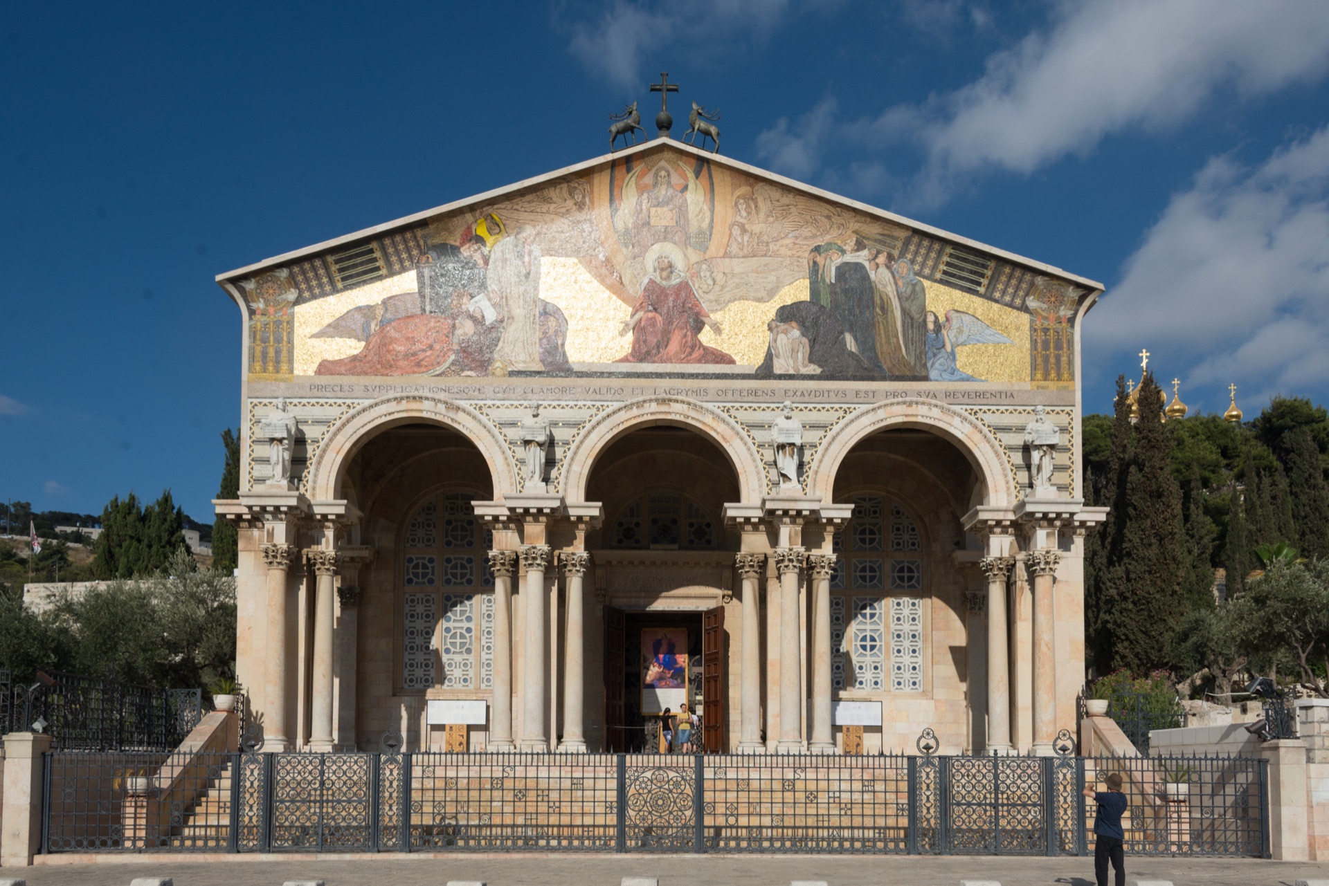 The golden Byzantine facade and triple-arch portico of the Church of All Nations
