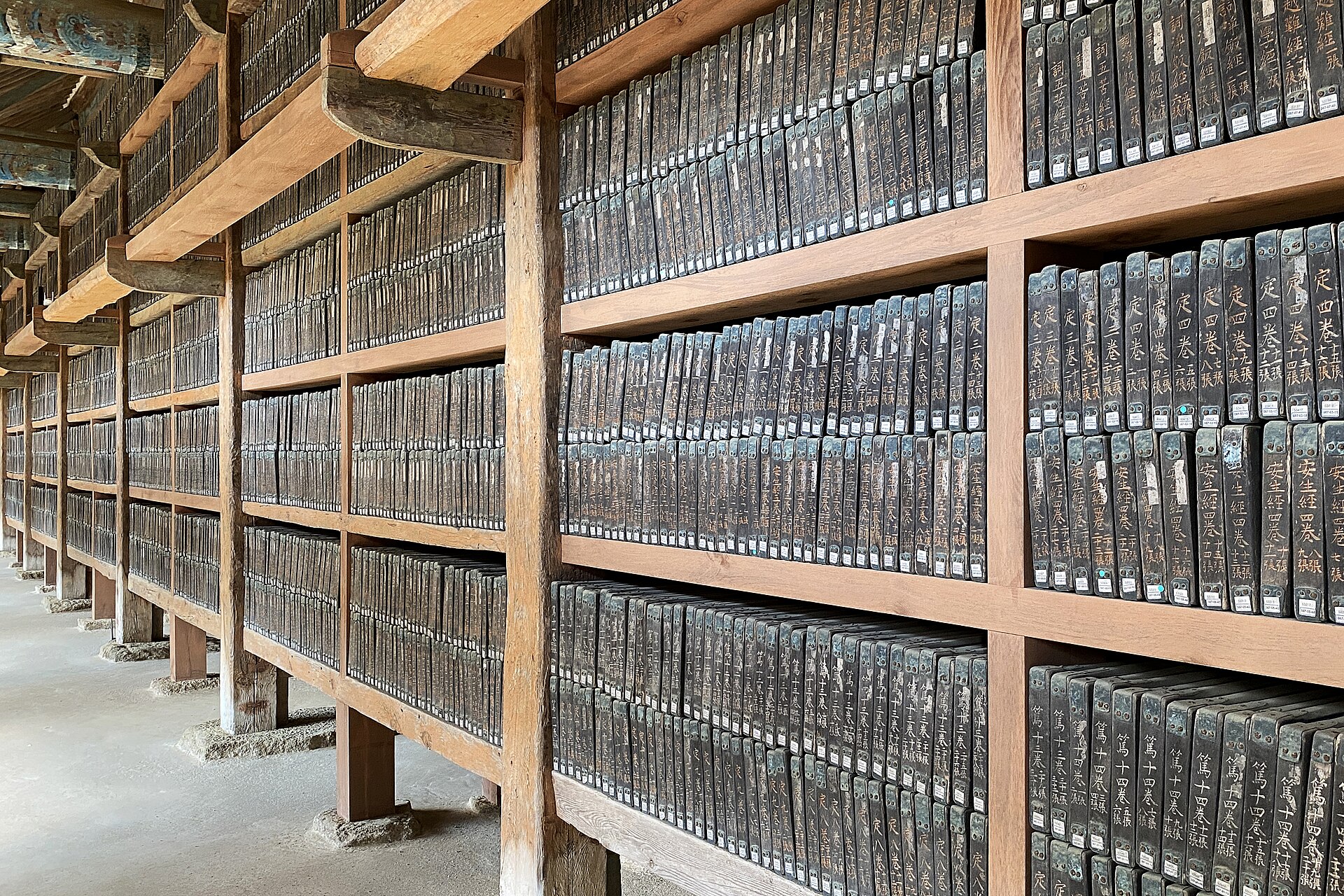 The Tripitaka Koreana woodblocks packed row upon row on the shelves