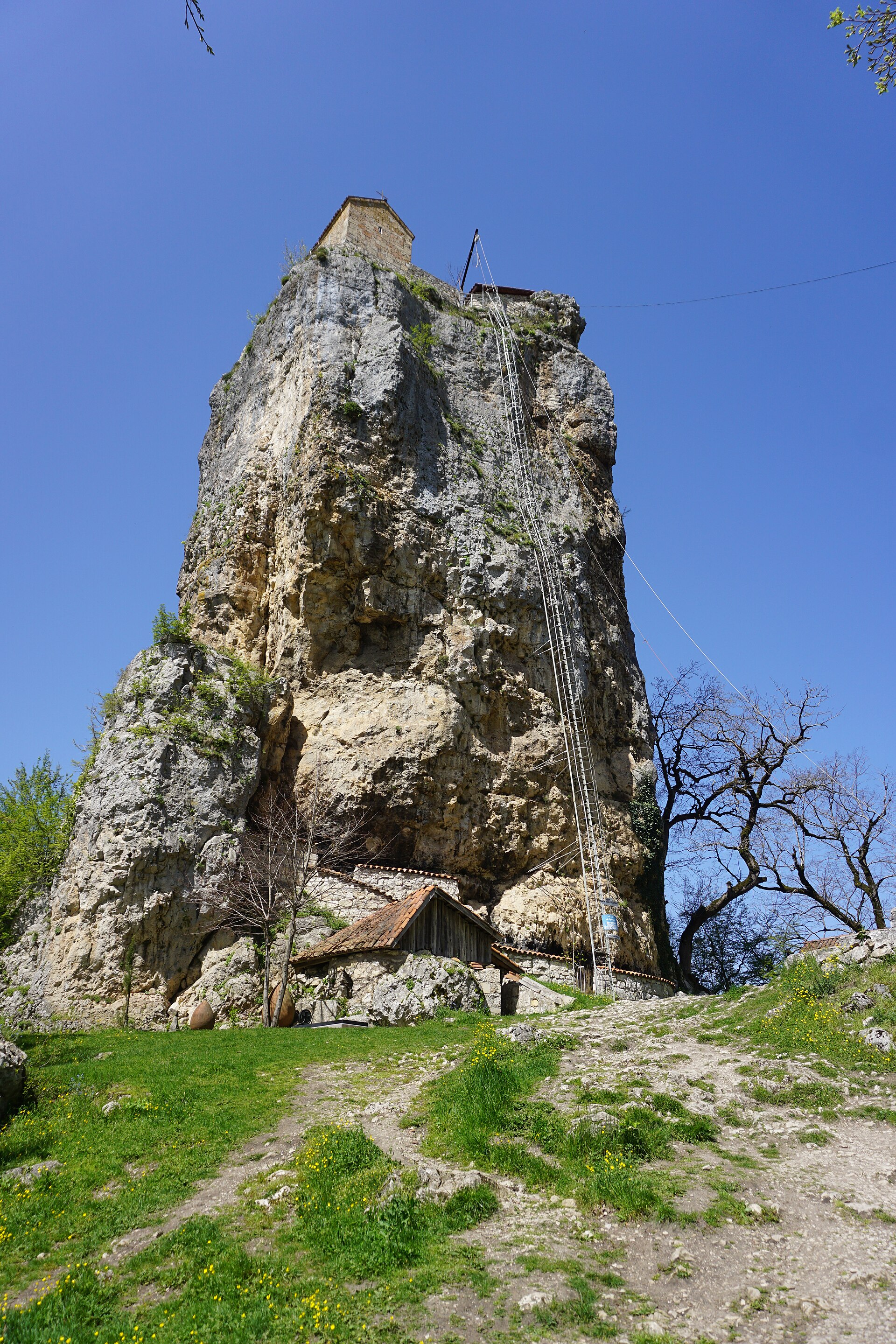 Katskhi seen from below — a long ladder running up the flank of the rock