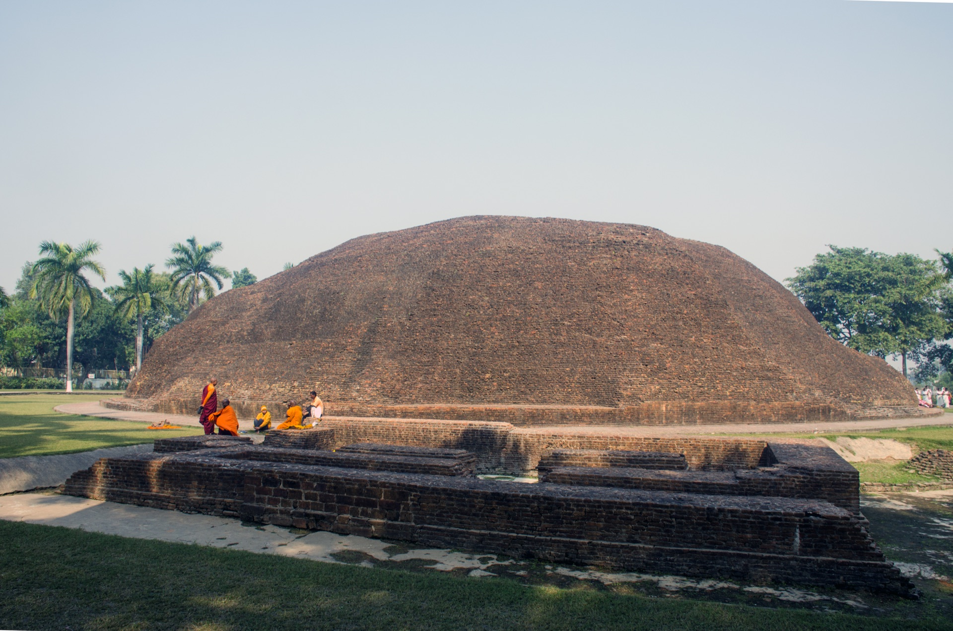 The Ramabhar cremation stupa with monks seated at its foot