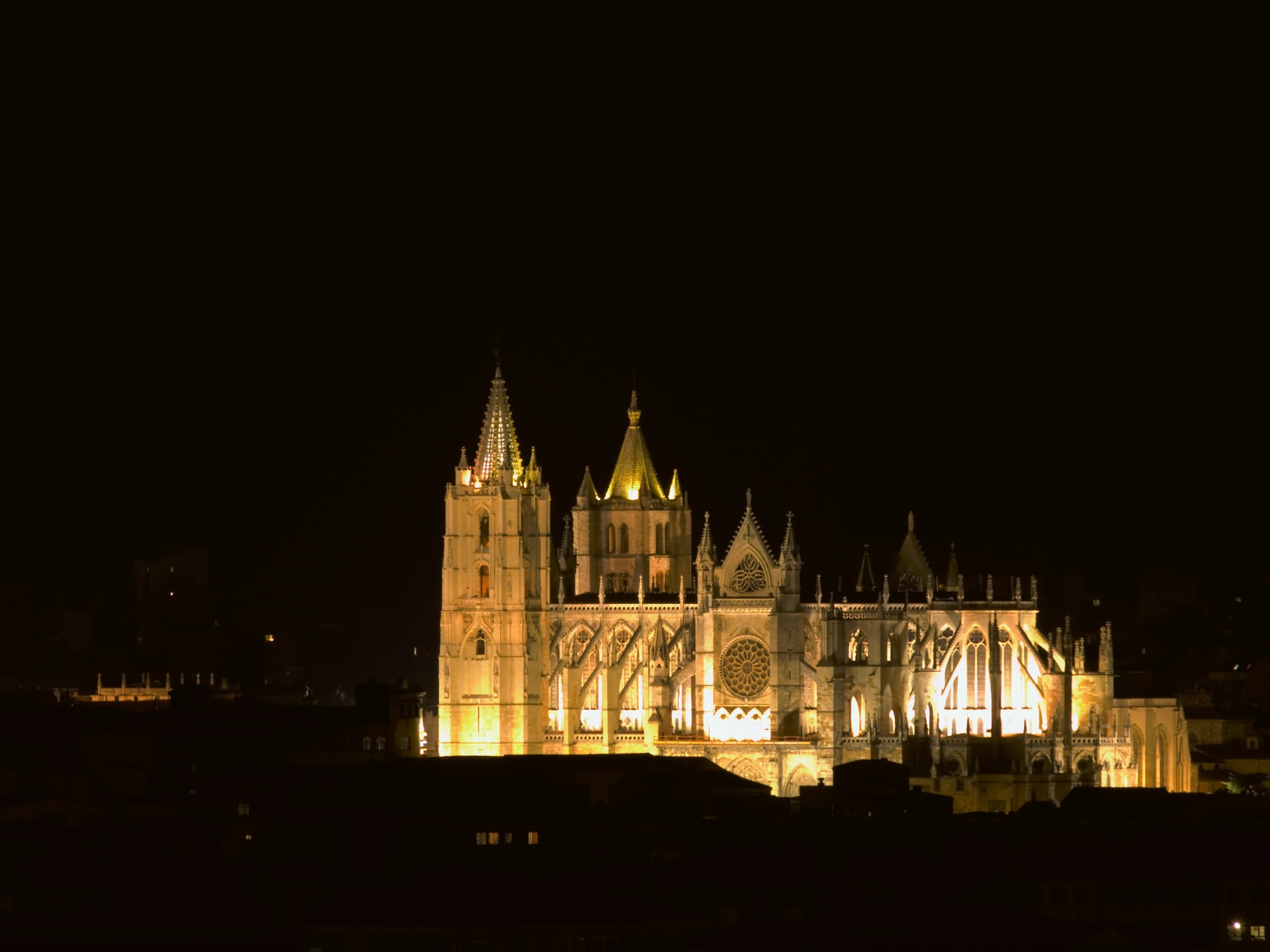 León Cathedral lit golden against the night