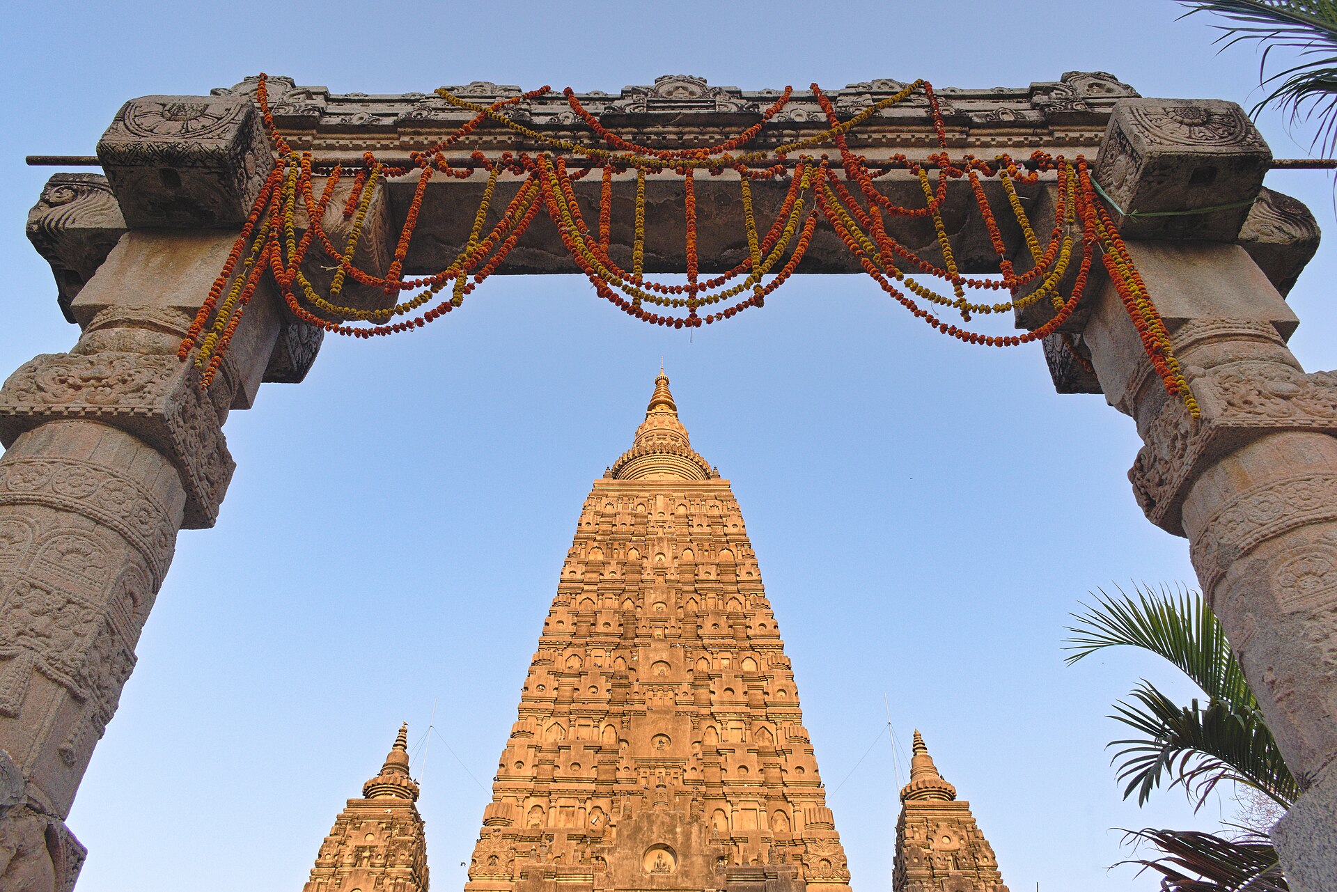 The great tower seen through a gate hung with marigold garlands