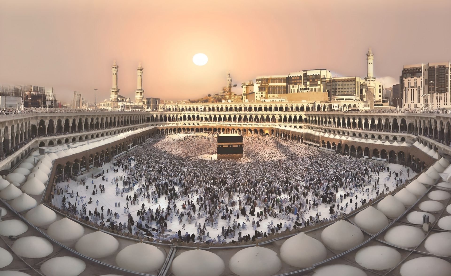 The Grand Mosque at sunset, the Kaaba ringed by a white sea of pilgrims