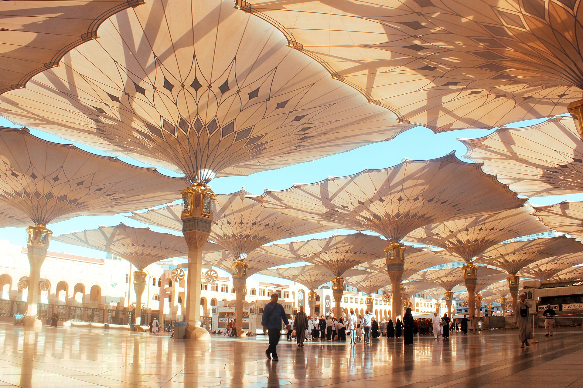 Great parasols spread over the courtyard of the Prophet's Mosque
