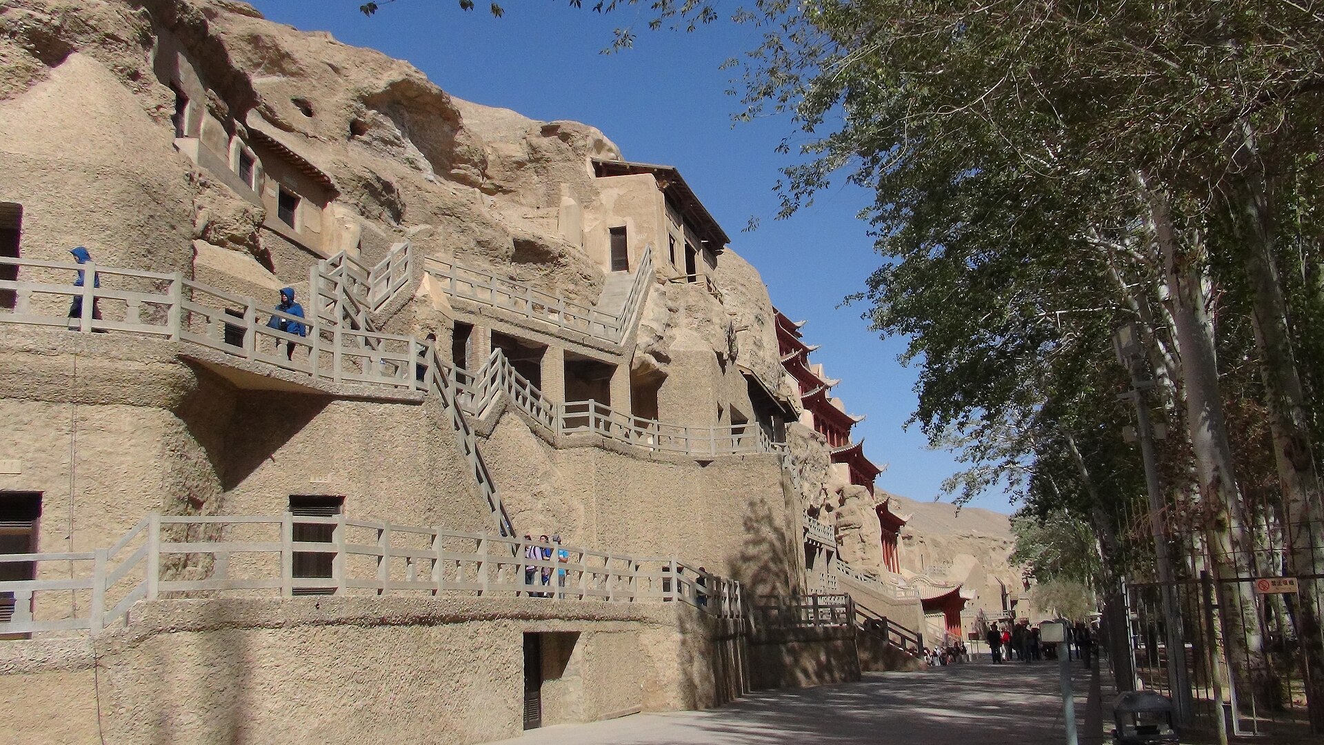 The honeycombed cliff of the Mogao Caves, riddled with grottoes