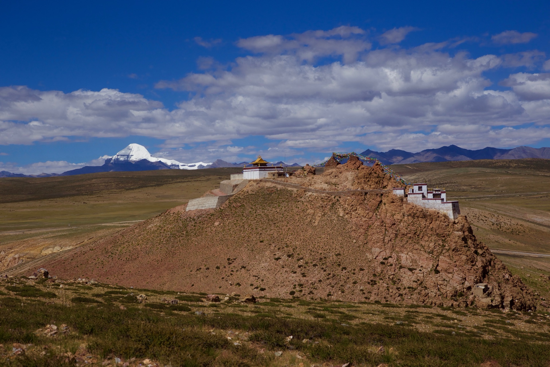The snow peak of Kailash rising over the plateau beyond Chiu Gompa