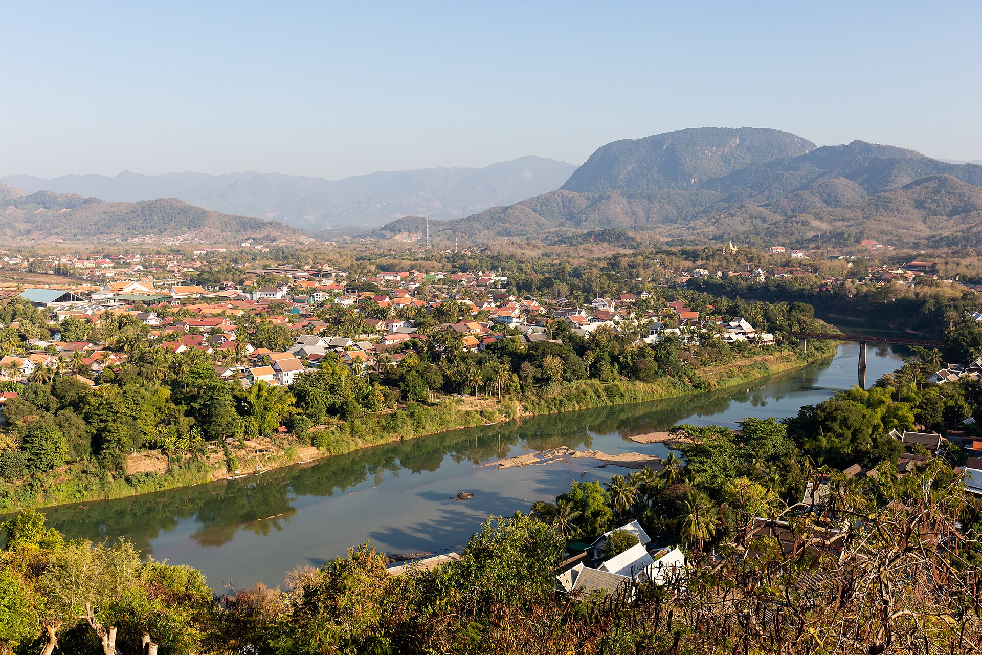 The old town of Luang Prabang, the winding river and folded ridges seen from Mount Phousi