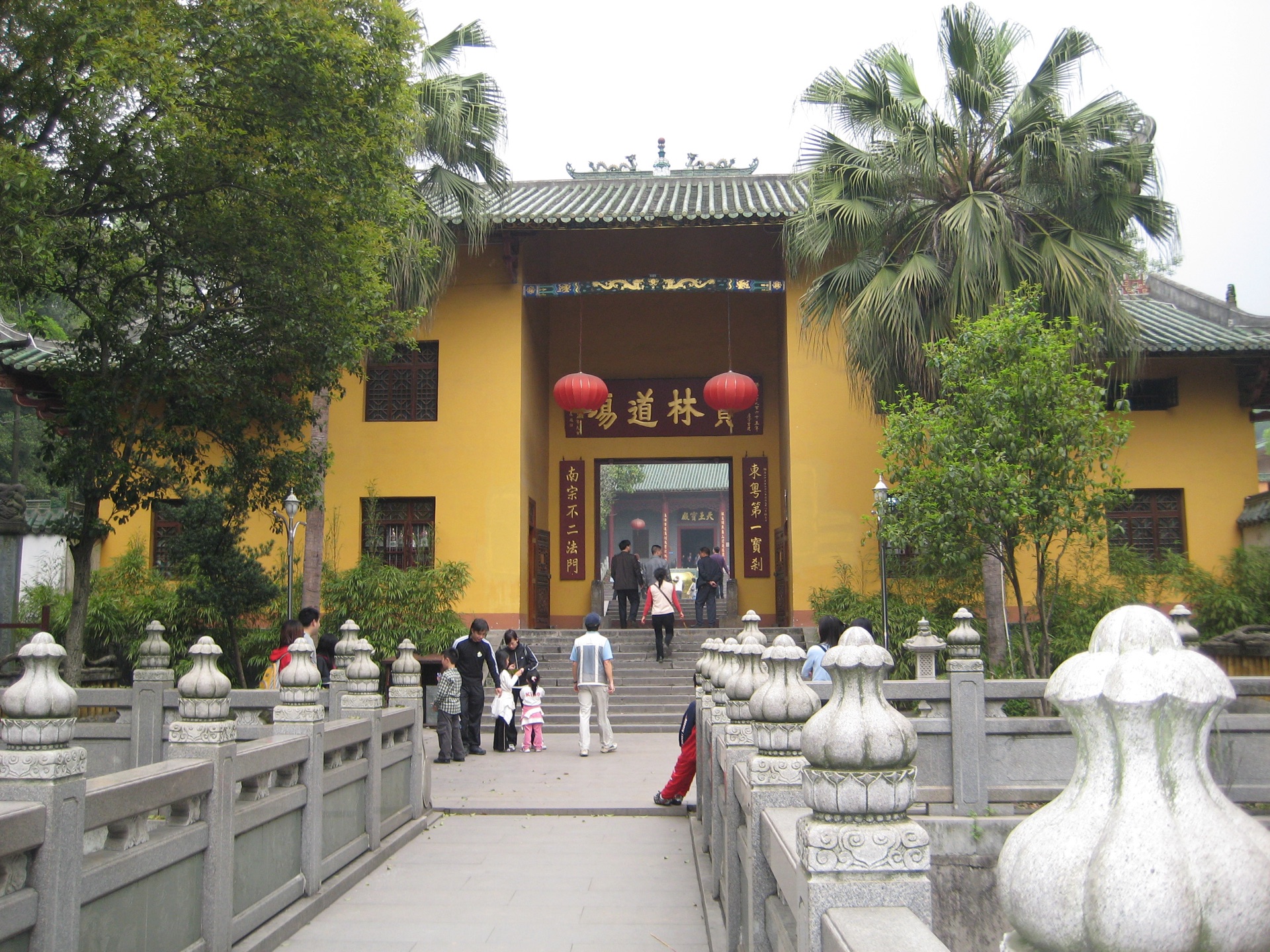 The Caoxi gate of Nanhua Temple, yellow walls hung with red lanterns