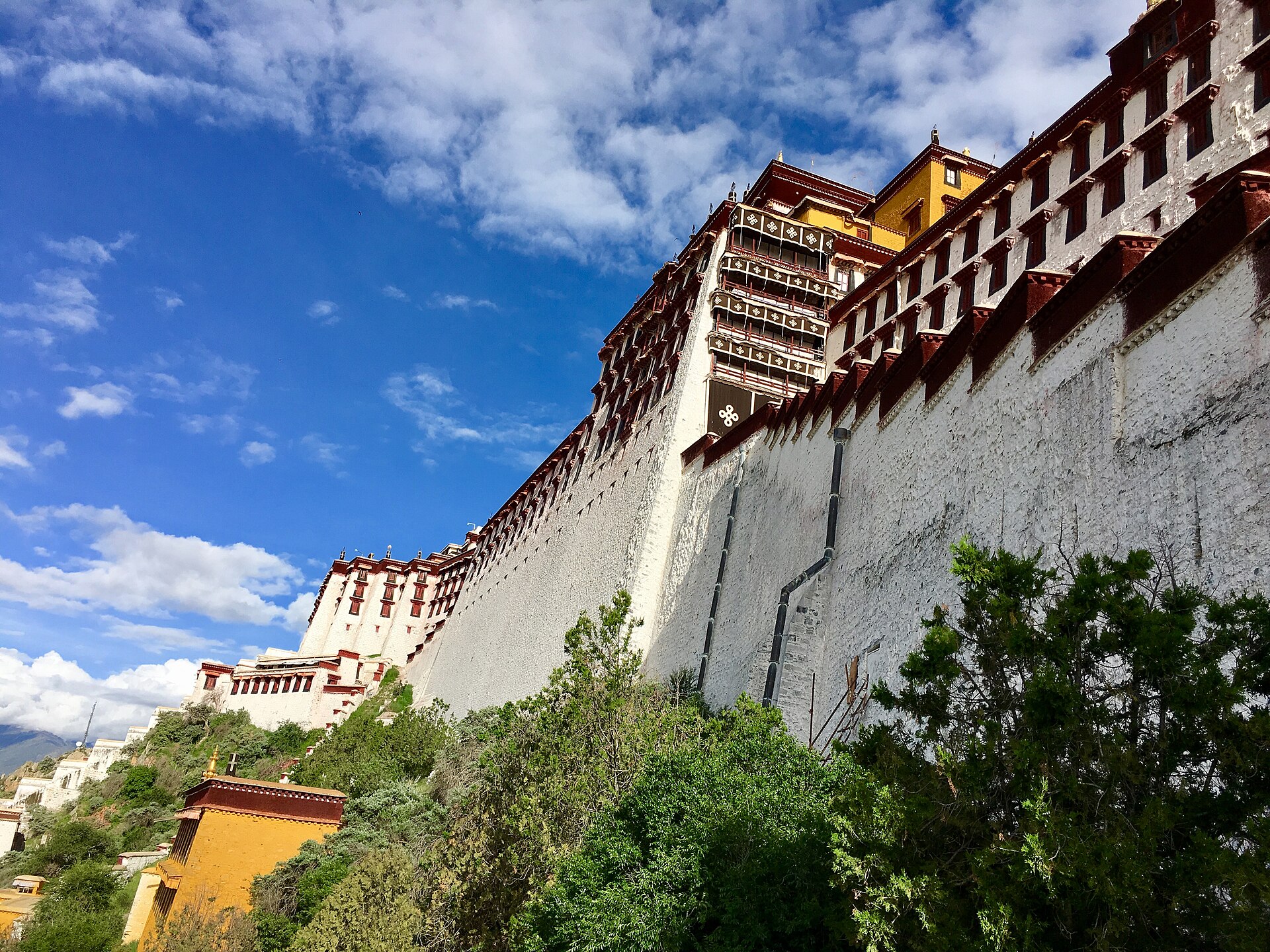 The white ramparts and eaves of the Potala seen from below