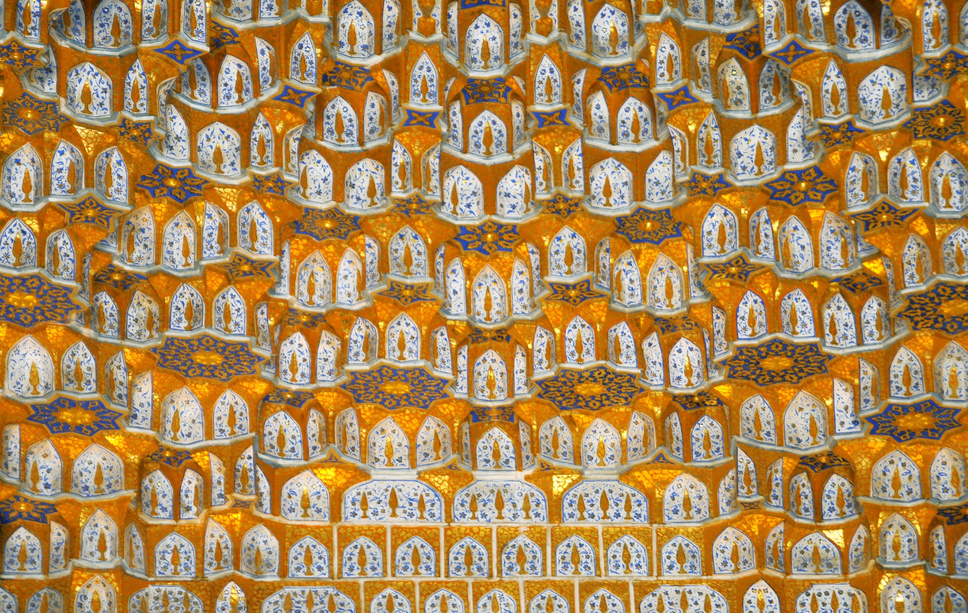 The gilded muqarnas glowing inside the Tilya-Kori madrasa