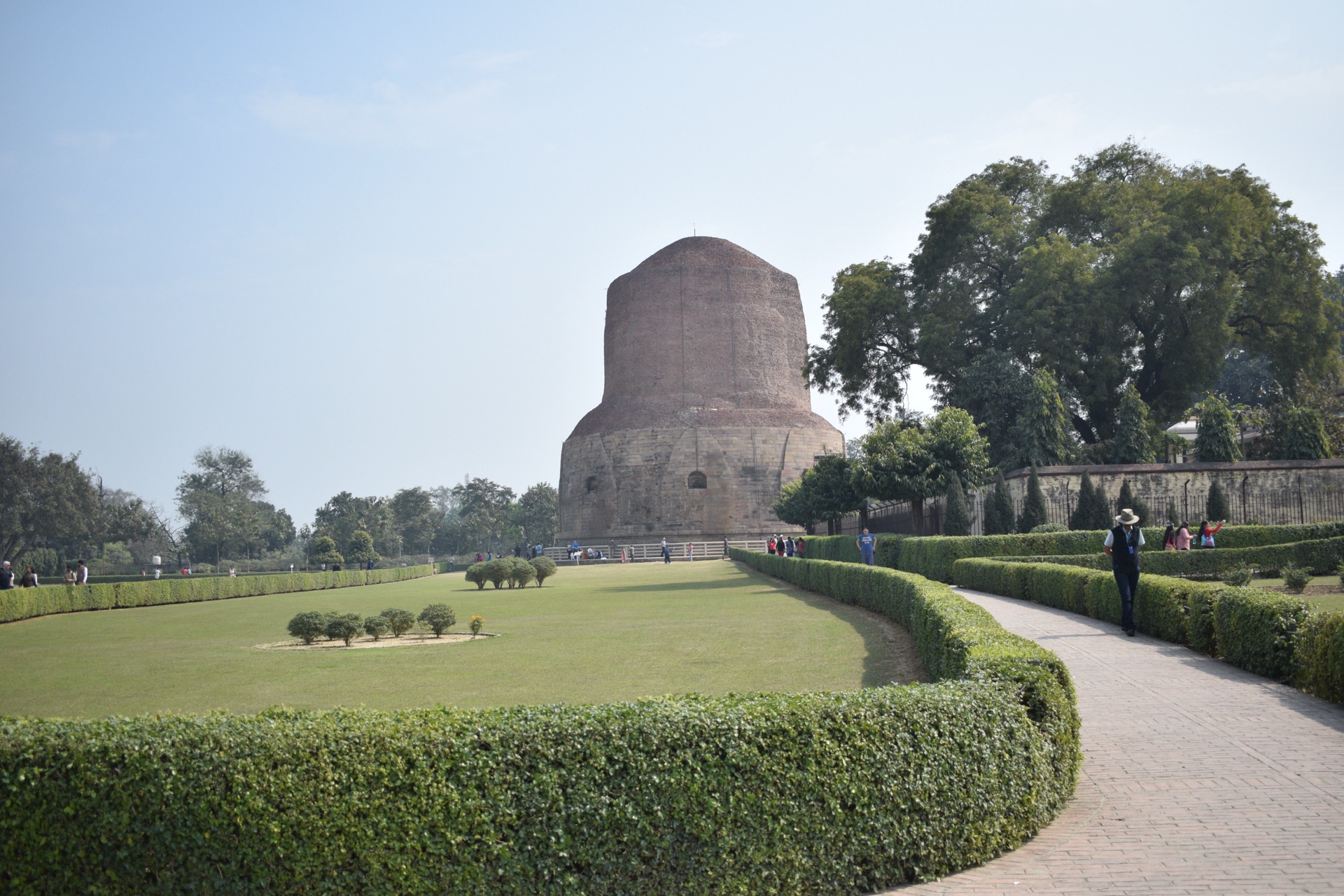 The Dhamek Stupa rising beyond a garden path