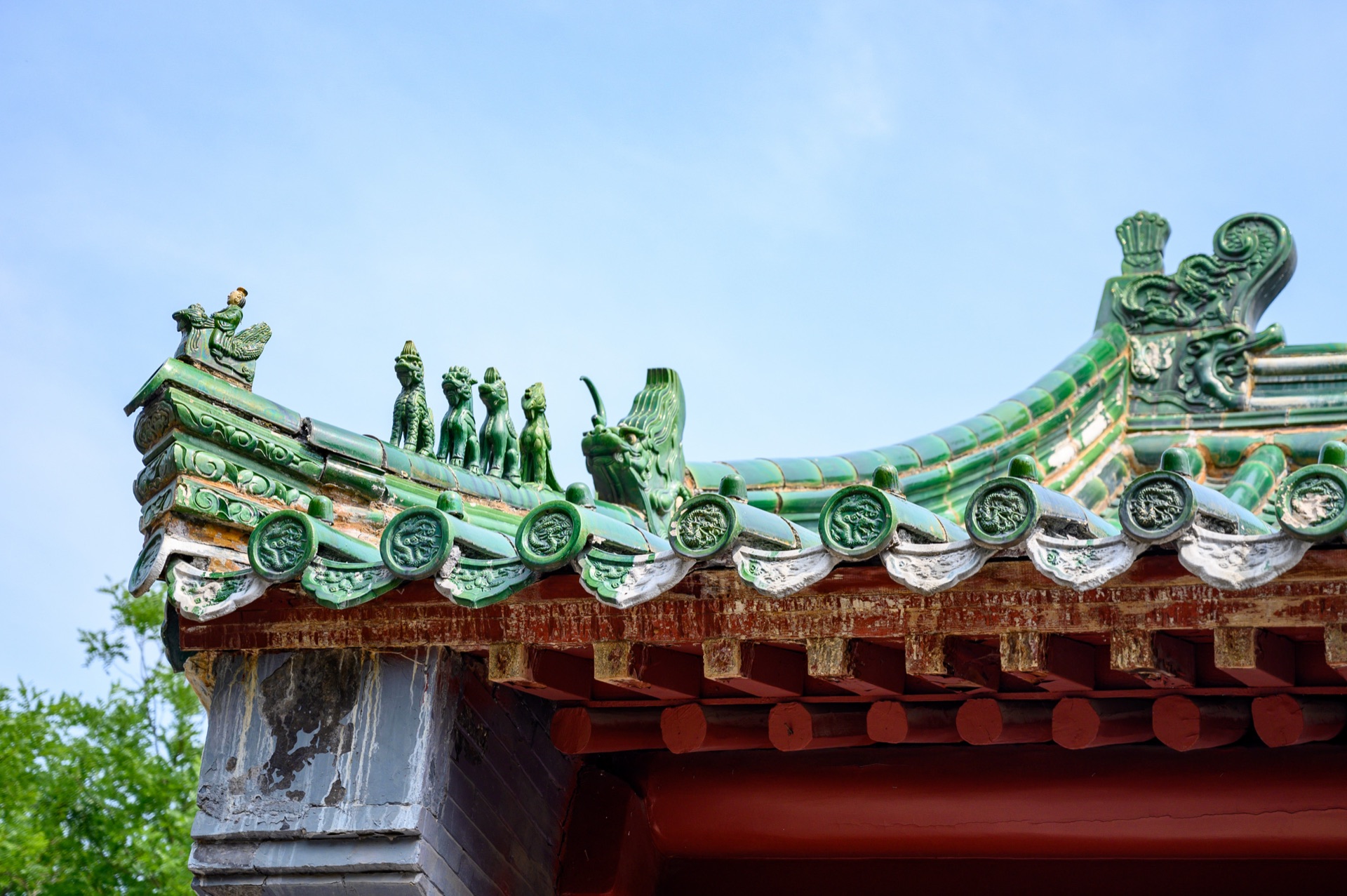 Green-glazed roof tiles and roof-ridge guardian beasts of a Shaolin hall