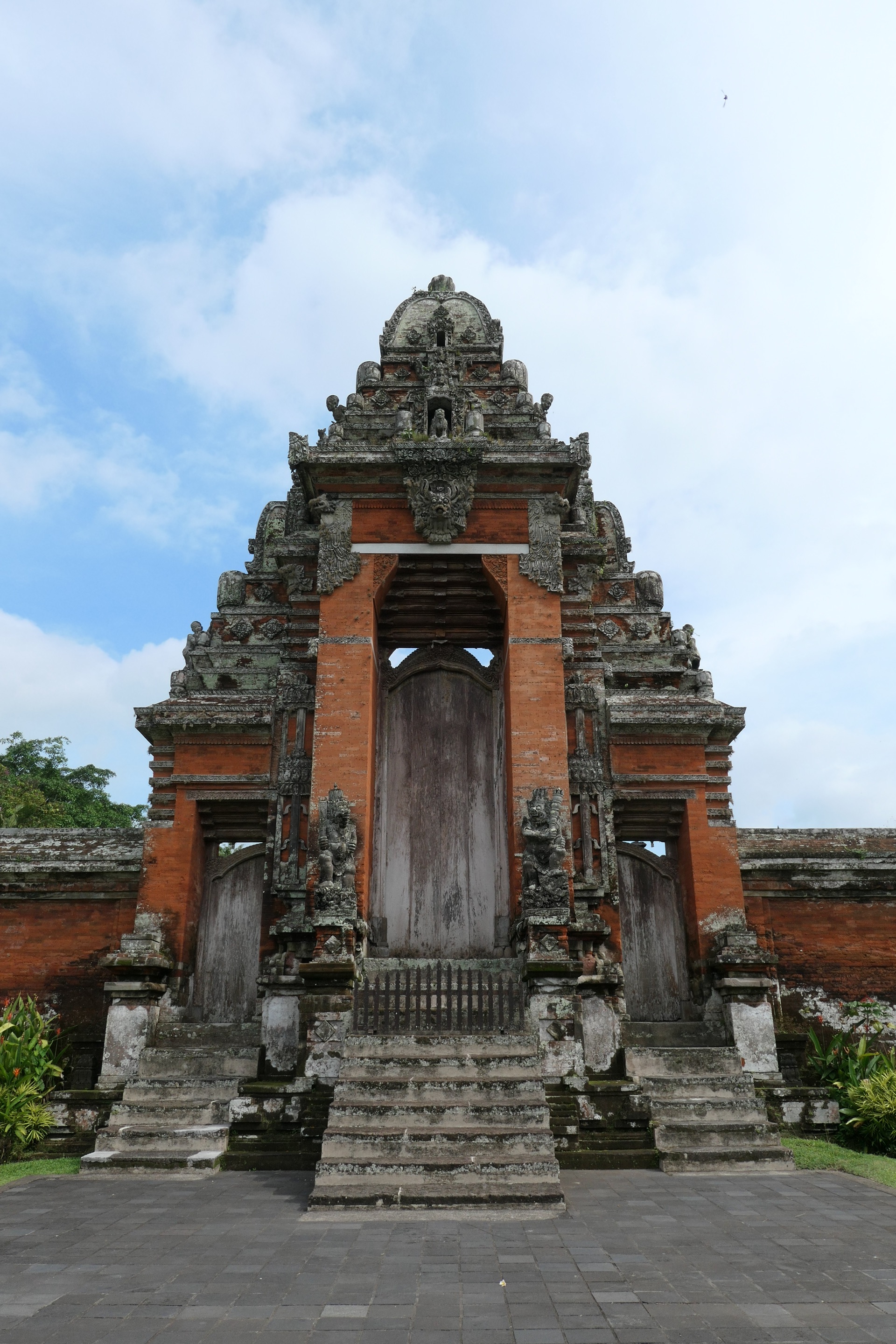 The towering kori agung main gate of Taman Ayun in carved red brick