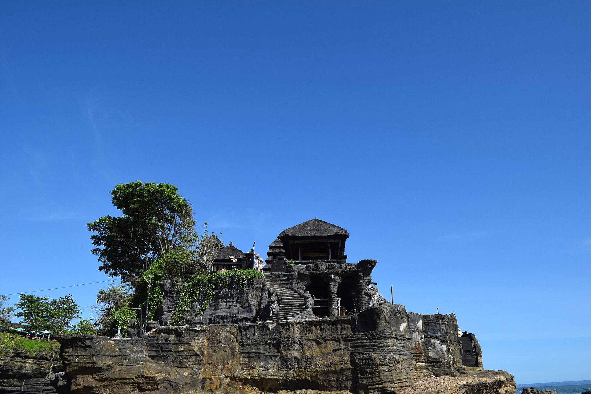 The temple sanctuary atop the rock against a deep blue sky