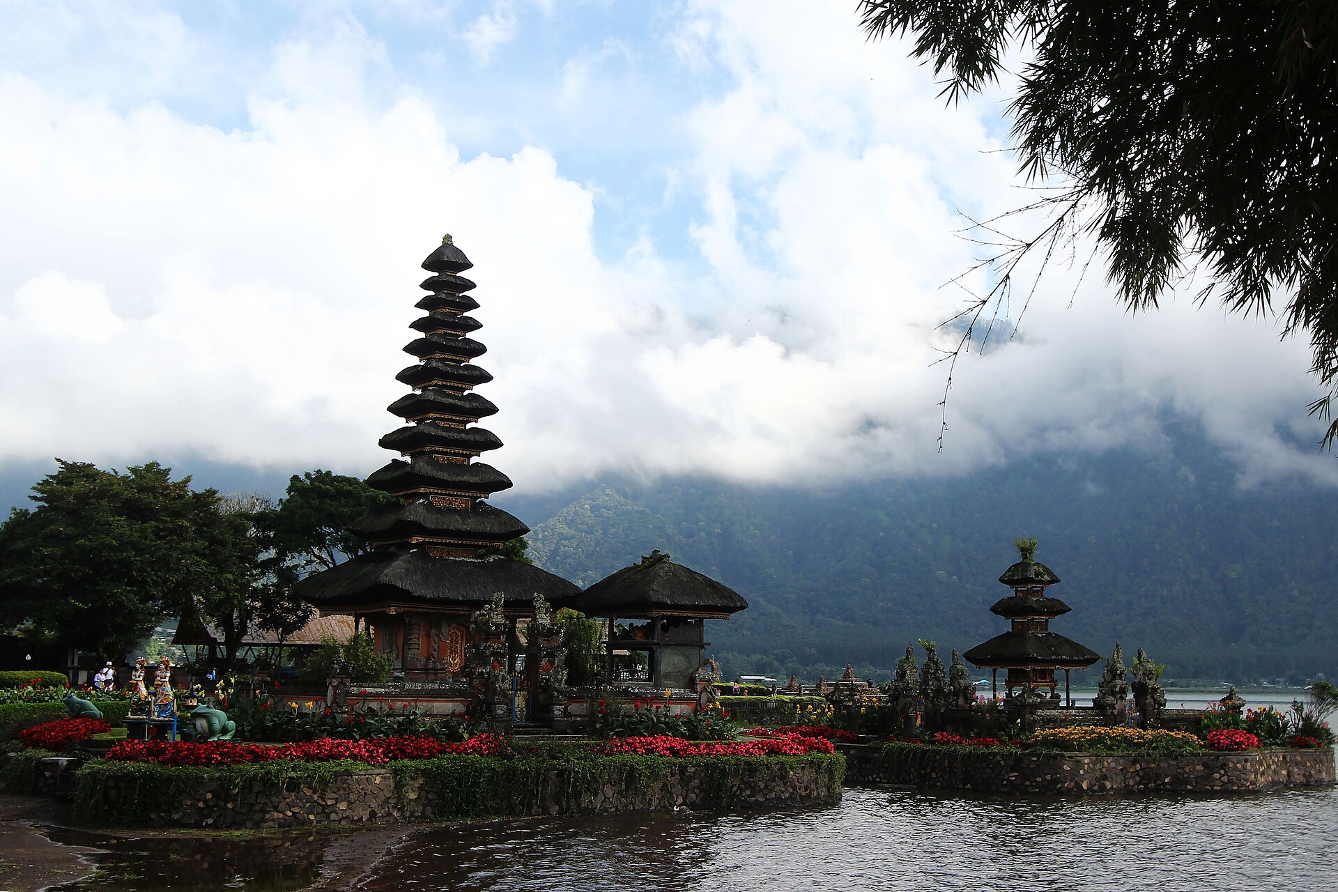 The lake temple against a cloud-wrapped mountain