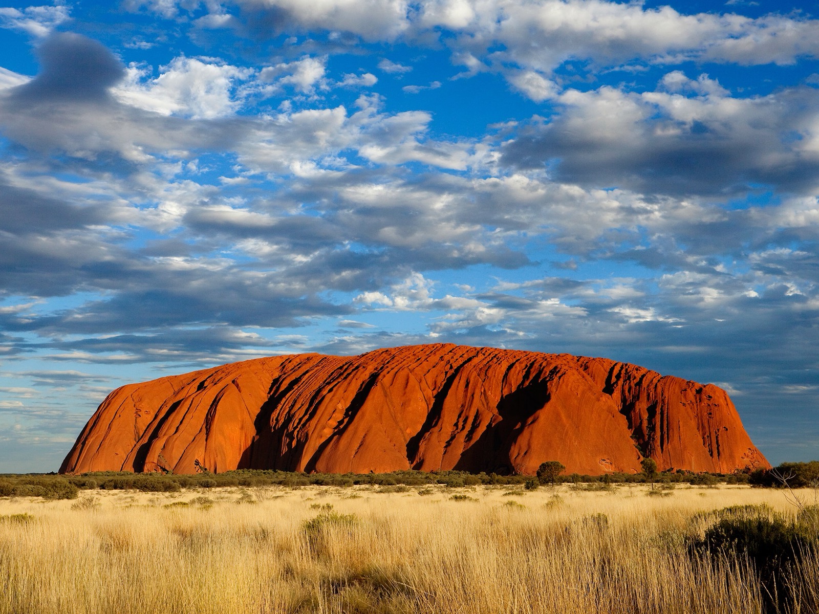Uluru glowing red at dusk