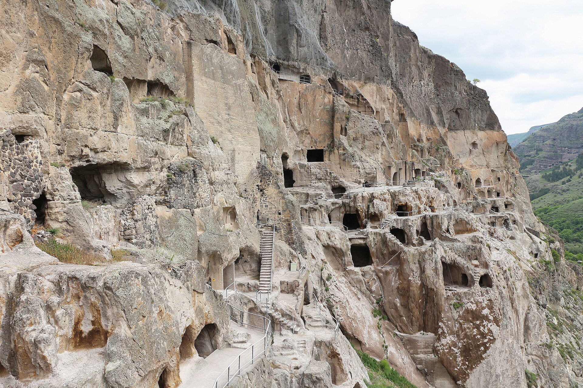 Rooms and stairways cut in tiers into the Vardzia cliff, seen close
