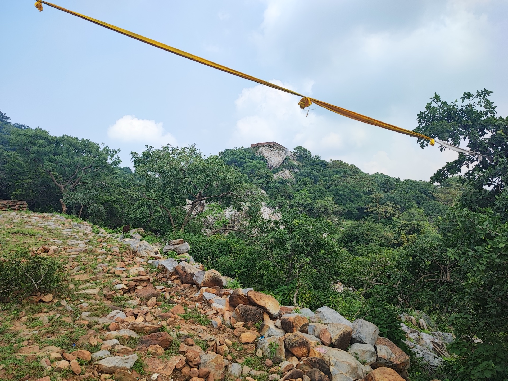 The vulture-shaped rock beyond the ridge, a golden cloth strung above